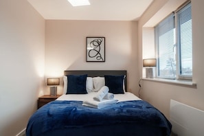 Your tranquil bedroom retreat, with wardrobe storage for added convenience and nearby access to the dining space.