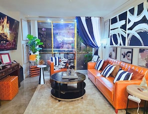 Take in iconic views from your living room as it opens into a 24th-story terrace