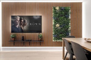 Air-conditioned luxury, elegant design, and stunning 75-inch Smart TV comfort.