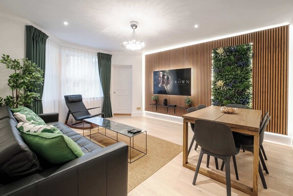 Air-conditioned luxury, elegant design, and stunning 75-inch Smart TV comfort.