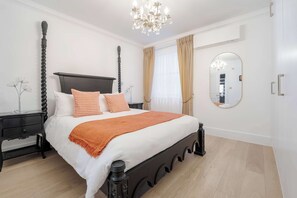 Luxurious en-suite with double bed, A/C & private bath for pure relaxation.