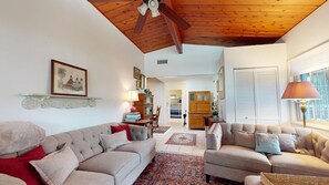 Living area with couch, love seat, and ottoman