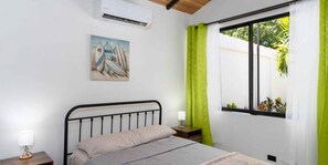 The master bedroom offers exceptional comfort, with a beautiful window view and a private en-suite bathroom.

