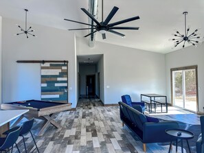 There's a dining table for 4, plus 6 barstools at island, & 2 more desk.