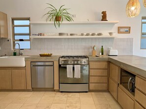 Kitchen is bright, modern, and fully equipped.
