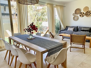 Bright and airy open layout—perfect for gathering, relaxing, or sharing a meal.