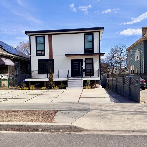Front of the house. There is a private entrance in the back. 