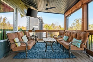 - Lounge in comfort on plush cushioned seating surrounded by peaceful treetop views
- Savor fresh air & calm evenings in a screened in space made for relaxing, rain or shine
- Kick back with a movie, cool breeze, & all the cozy outdoor vibes you love