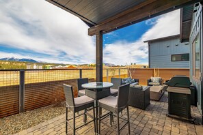 Back patio with grill and outdoor seating