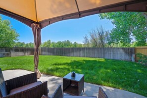 Enjoy outdoor dining and relaxation under the covered gazebo, complete with cozy seating and a BBQ grill for effortless cookouts. A perfect spot to unwind while taking in the fresh air..