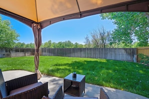 Enjoy outdoor dining and relaxation under the covered gazebo, complete with cozy seating and a BBQ grill for effortless cookouts. A perfect spot to unwind while taking in the fresh air..