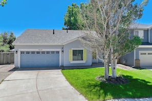 Welcome to our charming home with an attached garage and inviting curb appeal, offering a cozy stay in a peaceful neighborhood.