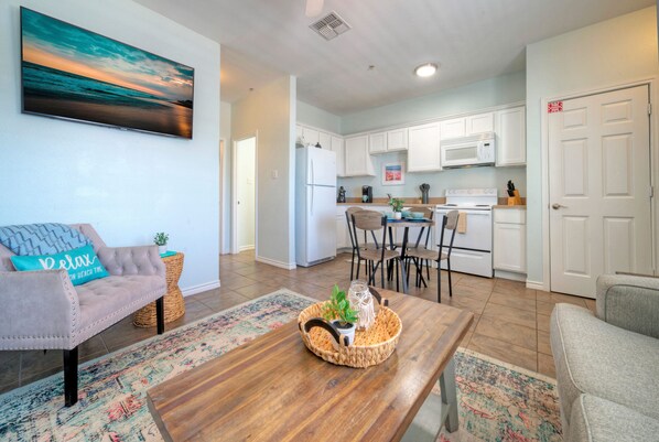 Coastal interior living room with sleeper sofa.