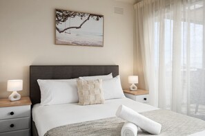 Master bedroom opening onto bay facing deck