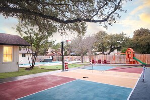  Game time! Pickleball, basketball, and endless fun on your private sportscourt! 