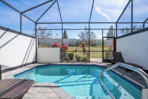 Relax by the pool with comfortable patio furniture.