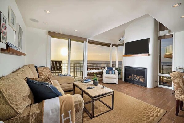 Golden hour from the living room with water views 