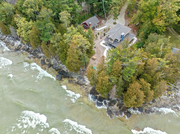two quaint cottages right on Lake Michigan next door to one another