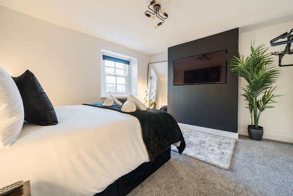 King-size master bedroom with TV