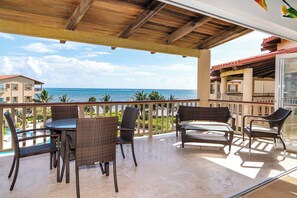 Large balcony with ocean and pool views