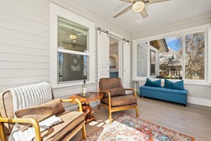 Enclosed Sun Room | Perfect for morning coffee or wine time!