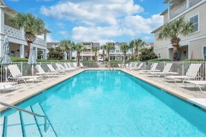 Relax and unwind in the seasonally heated community pool, perfect for year-round enjoyment!