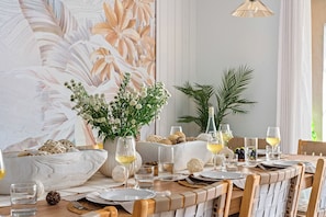 Elegant family house with pool, stylish decor, and spacious dining area