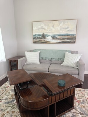 Coffee table has built in TV trays