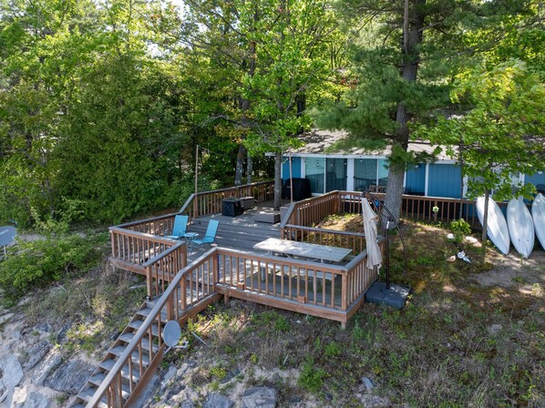 Spacious deck with stunning lake views, perfect for outdoor dining and relaxation.