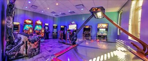 The resort's 10,000 sq.ft. clubhouse features a complimentary game room equipped with various arcade games and entertainment options suitable for all ages.