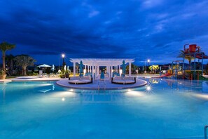 Unwind in a serene outdoor pool area designed for relaxation and enjoyment. The resort-style pool features a zero-entry point, making it easily accessible for all ages.
