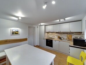 Interior Design, Flooring, Furniture, Kitchen, Floor, Wood, Ceiling, Countertop, Room, Lighting