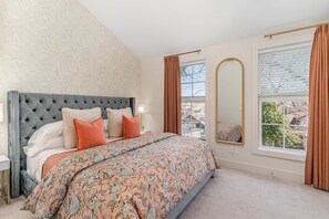 Primary bedroom with a King bed, smart TV, closet space, and en-suite bathroom. (3rd Floor)