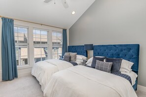 2nd bedroom with 2 Queen beds, with smart TV, large walk-in closet, and en-suite bathroom. (3rd Floor)