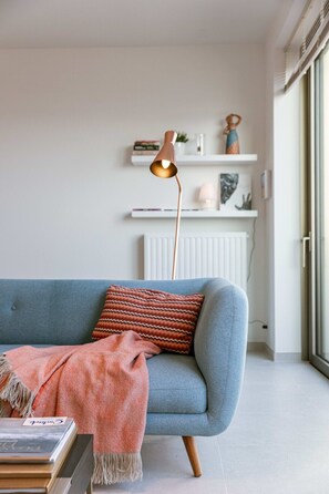 Open and bright living space with colourful artwork