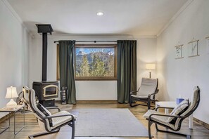 Unwind by the cozy nook, offering and views through the large window. Please note: the wood-burning stove is decorative and not available for guest use.




