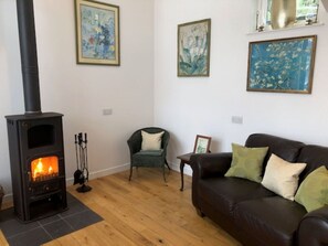 Furniture, Wall, Interior Design, Wood, Flooring, Hearth, Floor, Room, Living Room, Brown
