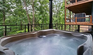 Step out on the deck and enjoy your own private hot tub
