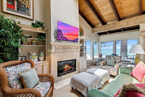 Cozy living room with lake views, fireplace, Bose surround sound, and games for the whole family