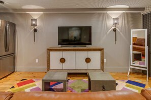 Living space with sofa sleeper, and TV