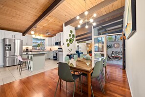 Stylish dining area seats 8. Open layout, perfect for meals and gatherings.