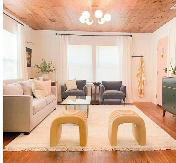 Living room with original shiplap, &mid-century modern furnishings from West Elm