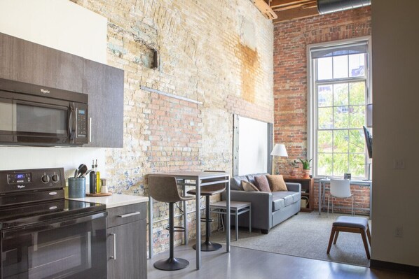 Spacious living room with exterior-facing windows