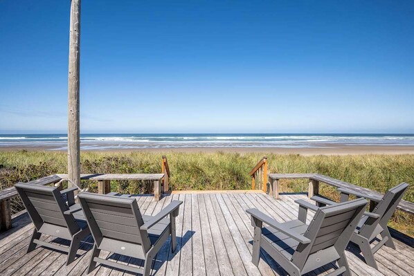Large deck with panoramic ocean views just steps to the sand
