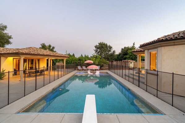 Enclosed pool with diving board
