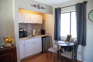 Kitchenette with coffee maker, microwave, refrigerator, electric skillet