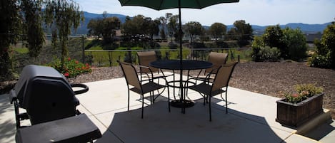 Private patio with BBQ and view.