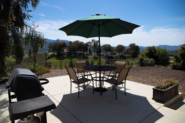 Private patio with BBQ and view.