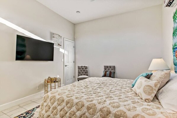Accent chairs and coffee table for relaxing in the room. TV with Roku and high-speed internet.