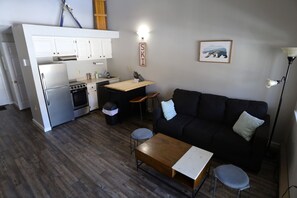 Living Room and Kitchen Space at Condo in Lincoln, New Hampshire